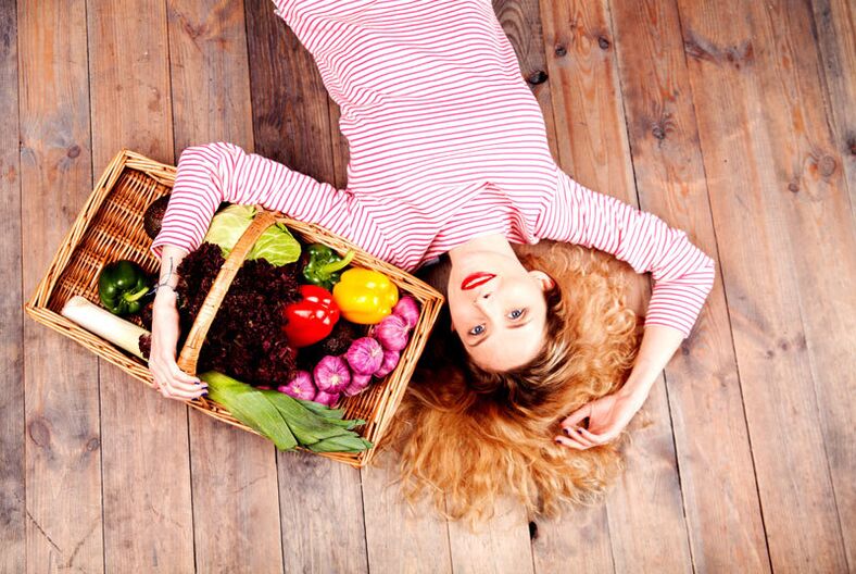 Girl with basket of vegetables